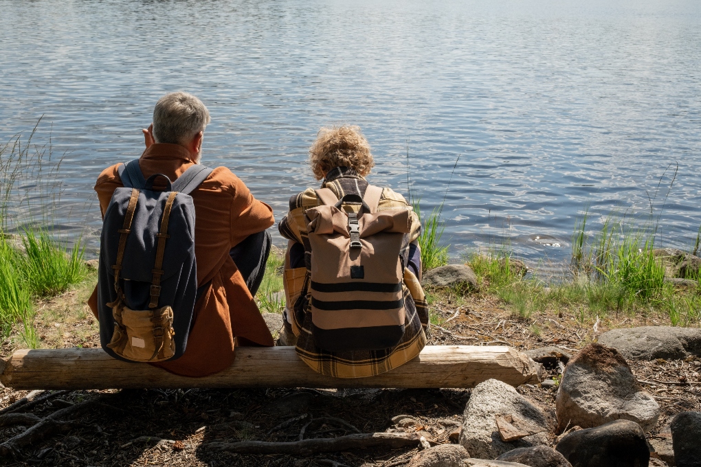 two people sitting by Gap of Dunloe lake
