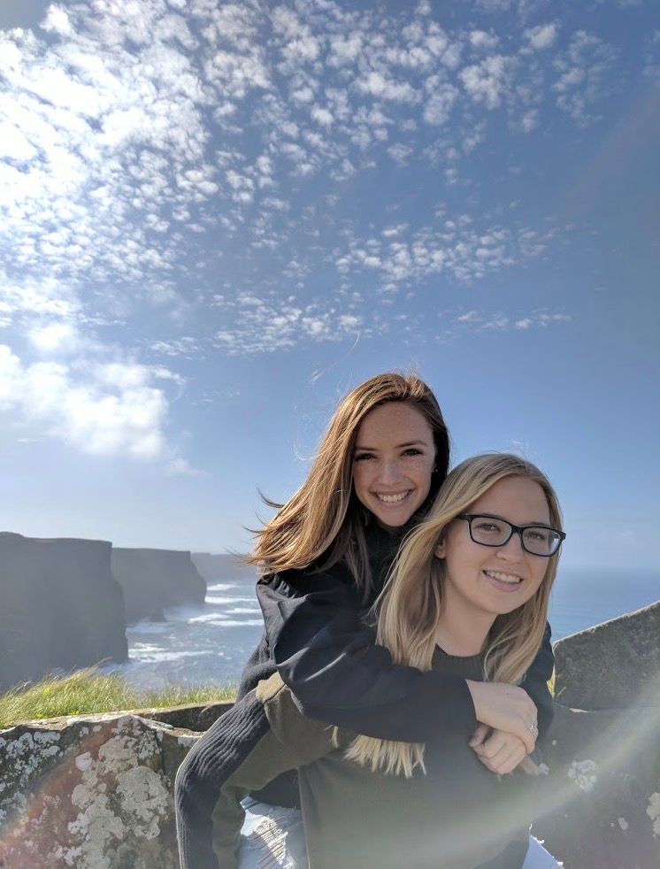 me and a friend in front of the Cliffs of Moher