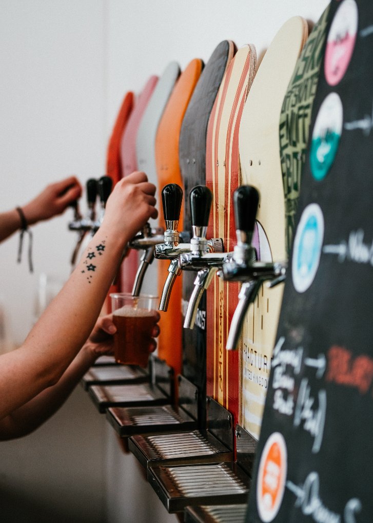 pouring beer at a brewery
