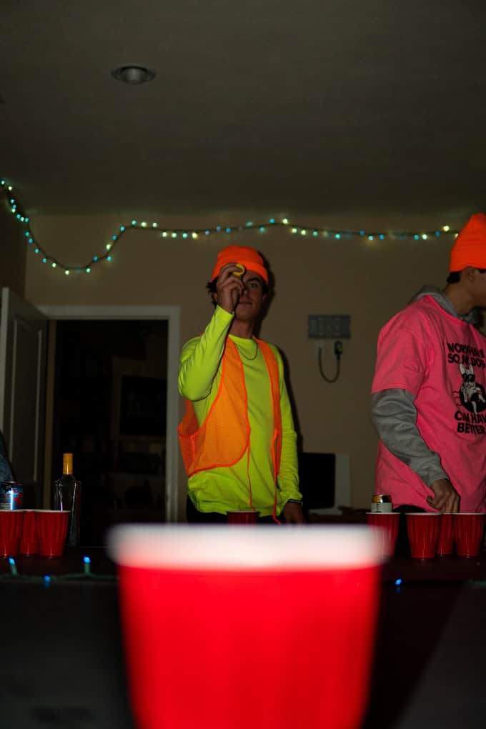 college party beer pong player