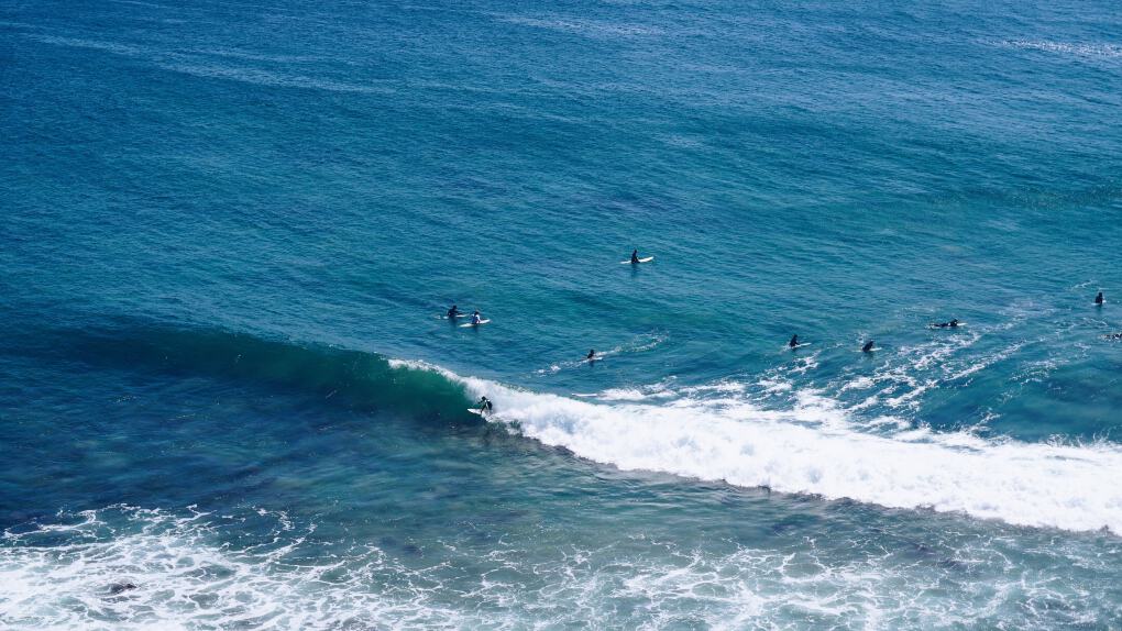 surfers at Zuma Beach