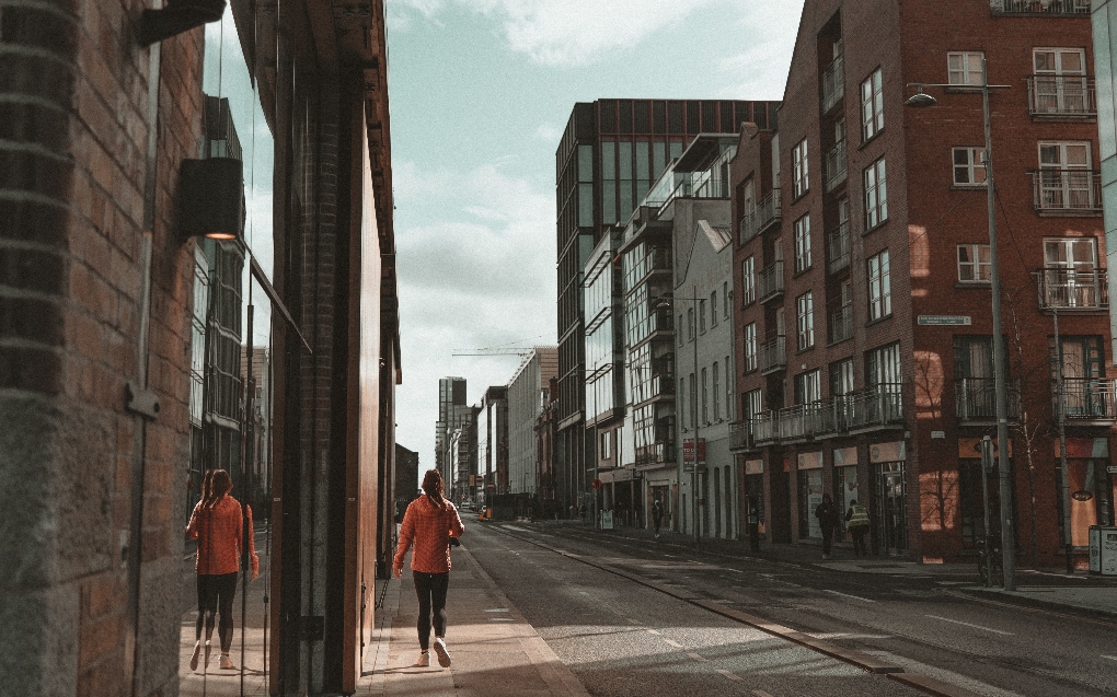 woman walking through Dublin on an empty street