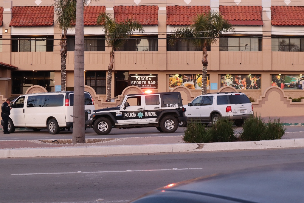 police cars in front of a taco shop in Rosarito, keeping us safe