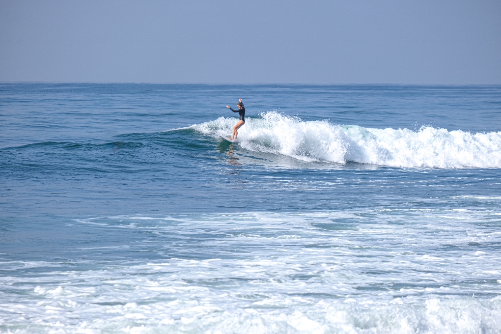 woman surfing in Baja CA